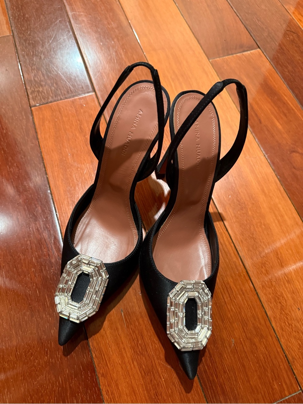 Amina Muaddi Black Satin Pointed Slingback Heels with Crystal Buckle